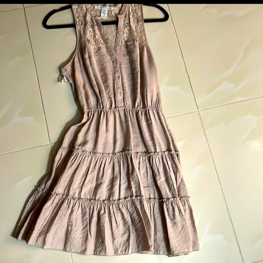 American Rag size M tan color, cinched waist, front buttons,